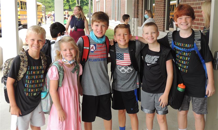 A group of students smiles
